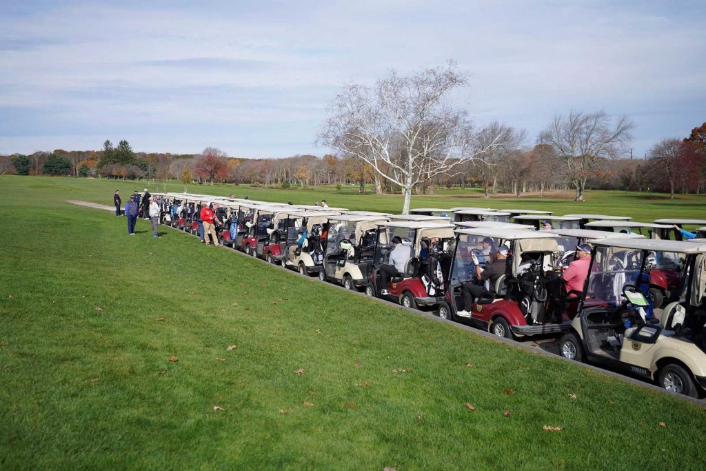 Golf carts in line at course - Charity Golf Tournament